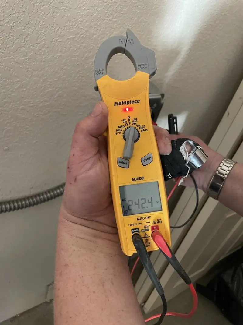 Voltage testing with clamp meter during Generator Installation in Black River Falls
